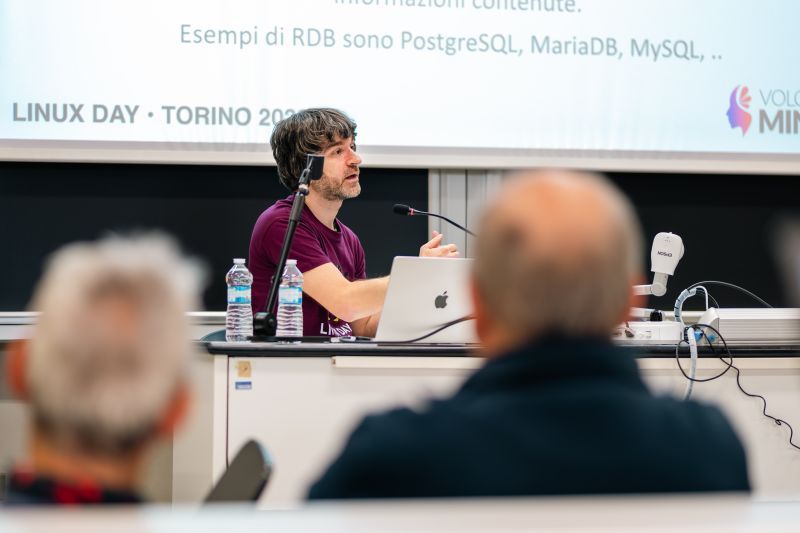 Volcanic Minds technical presentation on stage at Linux Day in Turin